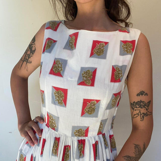1950s cotton ornate crest novelty print fit and flare sleeveless dress