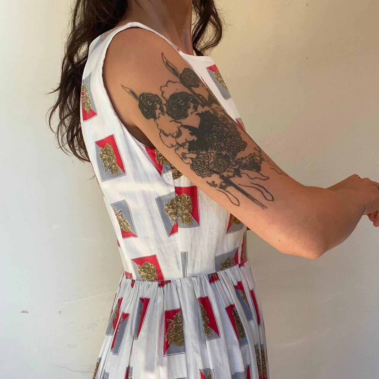 1950s cotton ornate crest novelty print fit and flare sleeveless dress