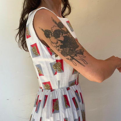 1950s cotton ornate crest novelty print fit and flare sleeveless dress