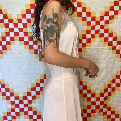 1940s light pink rayon dress with ruffled hem