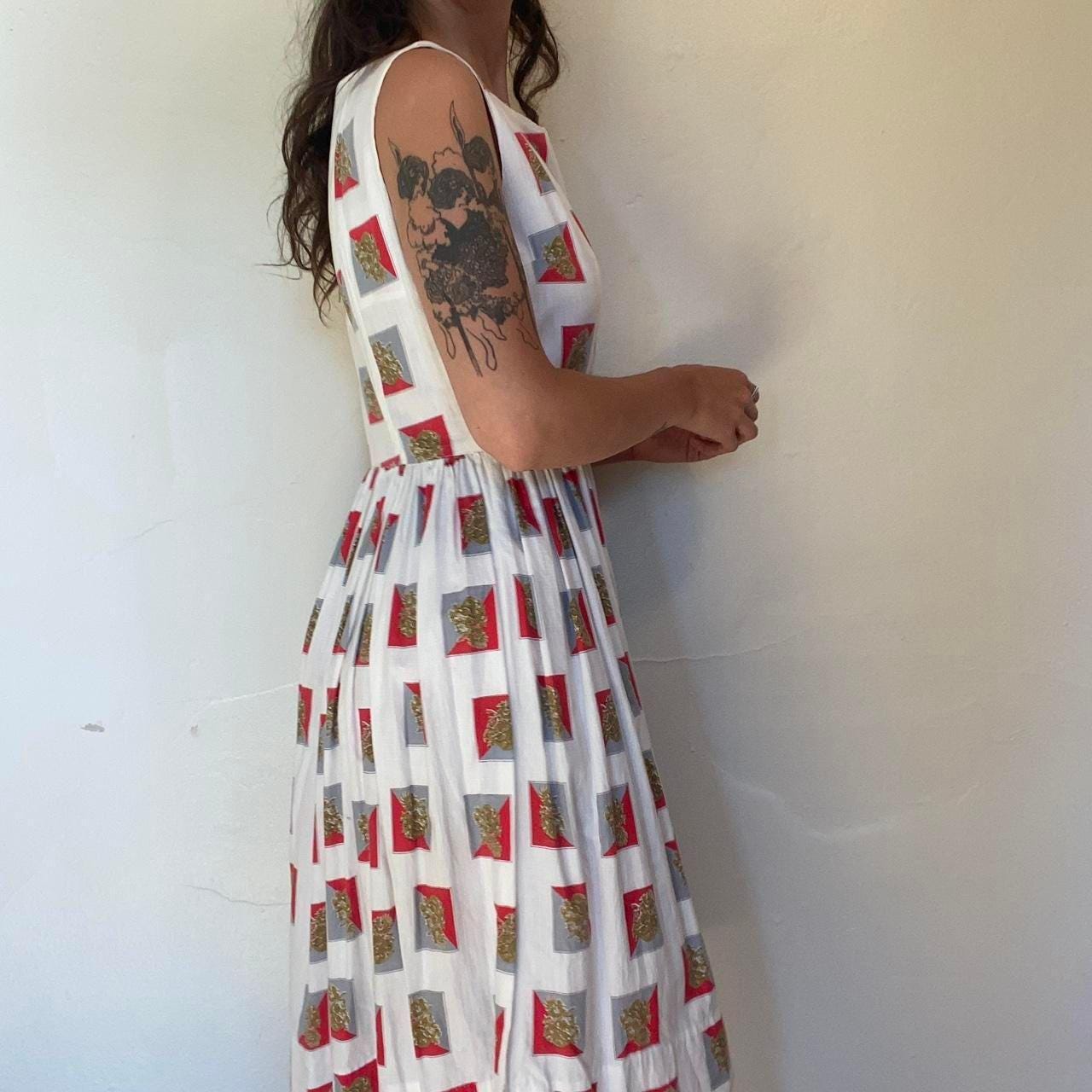 1950s cotton ornate crest novelty print fit and flare sleeveless dress