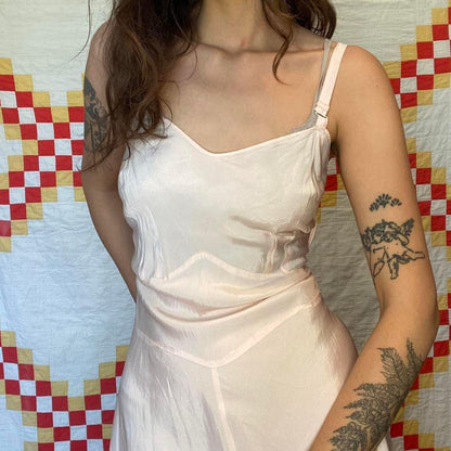 1940s light pink rayon dress with ruffled hem