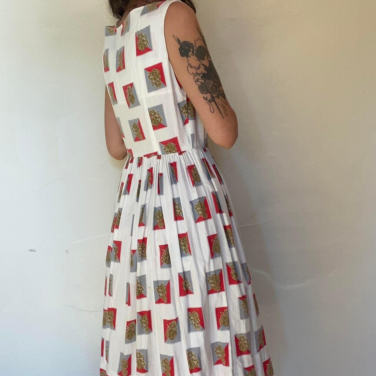 1950s cotton ornate crest novelty print fit and flare sleeveless dress