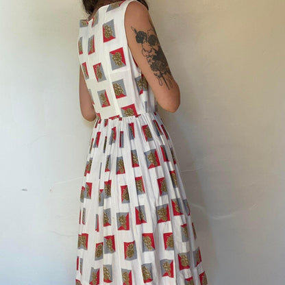 1950s cotton ornate crest novelty print fit and flare sleeveless dress
