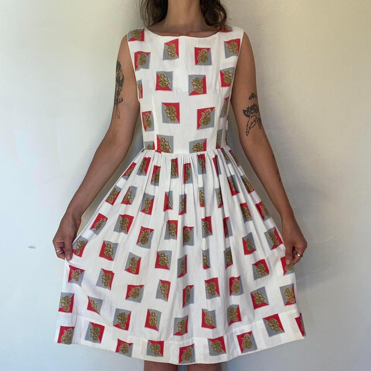 1950s cotton ornate crest novelty print fit and flare sleeveless dress