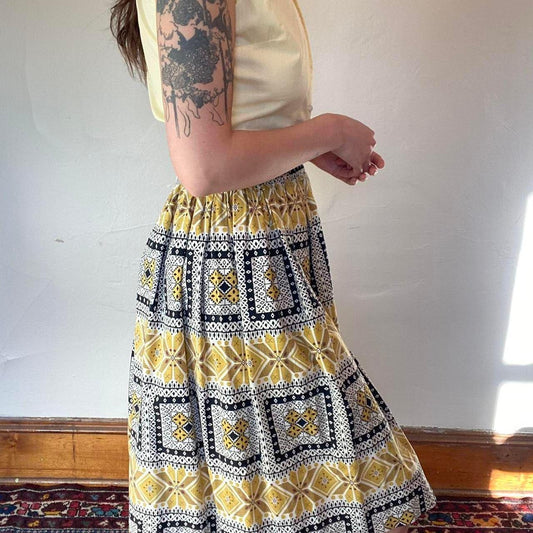 1950s cotton yellow and black folk art printed circle skirt
